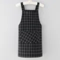 Black and white grid pattern cotton linen kitchen apron with front pocket for cooking. - Black