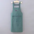 Green plaid sleeveless cotton apron featuring zipper pocket and cute bear print for kitchen cooking. - Green