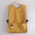 Gilet da lavoro giallo senape con tasche multiple e fibbie regolabili per i baristi. - Curcuma