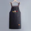 Waterproof kitchen apron with pockets and cross straps, stylish cartoon print for cooking. - Regular Fit / Black