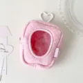 Close-up detail view of pink polka dot plush doll storage bag with heart window and hook - Pink (Polka Dot)