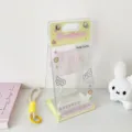 Full view of the transparent PVC doll display bag with angel wings and yellow handle - Yellow