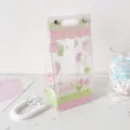Transparent PVC doll display bag with cute pink cake design for anime plushies - Pink & Green