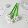 Set of three green novelty pens decorated with white fabric flower toppers for stationery gifts. - White