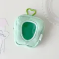 Close-up detail of plush storage bag showing the transparent window and green heart-shaped clip - Green (Polka Dot)