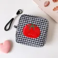 Close-up of a square black and white gingham storage pouch with a red tomato patch - Short / Black
