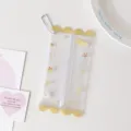Detail showing clear PVC mini doll storage pouch with yellow candy-shaped edges - Yellow