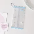 Detailed view of a clear PVC mini doll storage bag with light blue wavy edges - Blue