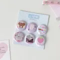 Close-up of six cute 25mm mini cartoon badges displayed on a blue checkered card - 6 Pieces/Set / Blue