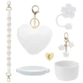 Stanley cup accessories set including silicone boot, straw cover, plush pompom and strap. - White