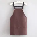 Brown kitchen apron with adjustable black straps and dual front pockets for cooking baking - Strap Style Coffee