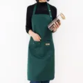 Dark green work apron with front pockets, adjustable neck strap, ideal for kitchen or coffee shop. - Neck Lanyard / Green
