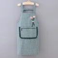 Green plaid cotton kitchen apron with cute floral decor, front pocket, and comfortable straps. - Green