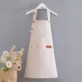Delantal infantil de lona con botones ajustables y bolsillo, ideal para pintar y manualidades. - Blanco Roto