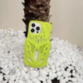 Detailed view of bright green silicone phone case with unique hollow design compatible with iPhone. - Green / iPhone 14 Pro Max