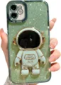 Detailed view of electroplated astronaut stand glitter phone case with shiny green finish. - 14 Pro Max / Sierra Green