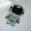 Hellblauer 3D Cartoon Astronaut Handyhalter, kreativer klappbarer Klebehalter Griff. - Grün