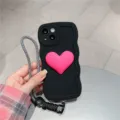 Stylish black silicone phone case with 3D pink heart and braided strap for iPhone. - iPhone 14 / Black