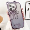 Schattige gegalvaniseerde glitter beer telefoonhoesje met standaard voor iPhone 15 Pro - Beer cameralensstandaard (Verloop paars) / 15promax