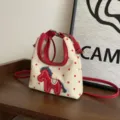 Sac à main mignon à pois avec broderie cheval, bandoulière polyvalente. - Rouge