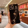 Black electroplated phone case with elegant heart wrist chain for iPhone, premium look. - Side Heart Black Wrist Chain