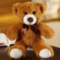 Simpatico orsacchiotto di peluche marrone foto dettaglio, bambola morbida con fiocco. - Marrone scuro / 30cm