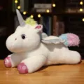 White light-up unicorn plush toy with colorful mane and silver glitter wings for gift. - Lying Down / 37 cm / White