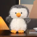 Adorable peluche pingouin bouclee, petite poupee en tissu douce pour cadeau enfant et griffe. - Manchot