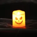Spooky Halloween LED electronic candle lamp with a glowing Jack-o'-lantern pumpkin face - Fierce Ghost Face