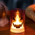 Orange Halloween LED candle lamp in glass jar with Jack-o'-lantern face design - Candle Style / Purple