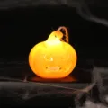 Illuminated festive orange Halloween LED pumpkin lantern with hanging hemp rope decor - Hollowed-out Expression Pumpkin Lamp