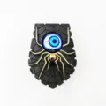Timbre de Halloween espeluznante con ojo azul brillante y una araña dorada. - Spider blue eye doorbell