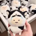 Cute black and white plush cow pendant featuring funny crying expression, soft toy accessory. - Crying Cow
