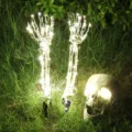 Glowing LED skeleton hands and skull garden stakes for Halloween outdoor decoration - Warm White Glowing Skeleton 3-Piece Set