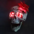 Halloween decoration glowing skull head with red LED eyes and a decorative flower - Glowing Skull With Red Flower Decoration