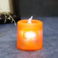 Orange LED Halloween candle light with glowing skull pattern for festive tabletop decor - Small orange skull