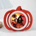 Orange wooden Halloween pumpkin LED light with haunted house silhouette for holiday decor - Pumpkin Castle Light