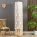 Detail view of the cylindrical vertical air conditioner cover featuring cute white clouds and tassel. - Cloud Coffee Stay-on Cover