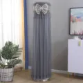 Detail view of gray mesh cylinder AC dust cover with elegant lace and bow decoration. - Butterfly Grey with Lining