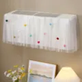 Close-up detail of white mesh air conditioner dust cover featuring colorful pom-pom hanging decor. - Universal for 1-1.5 HP (Length Within 86 cm) / Cute Pom-Pom AC Cover (Usable While Running)