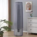 Detail view of the elegant gray mesh vertical air conditioner cover in a cozy living room setting. - Zu'an Grey