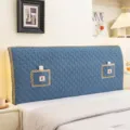 Blue quilted fabric headboard cover with lace trim and pockets for bedroom decoration. - Pocket Flowers Blue