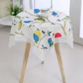 Close-up detail of the decorative round tablecloth featuring cute bird and branch patterns with lace. - 55*55CM / Fairy Tale World