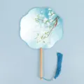 Traditional Chinese style round folding fan with wooden handle and elegant blue tassel decoration. - Eight-Petal Fan - Pure & Elegant