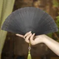 Vintage sandalwood folding fan with tassel, traditional Chinese style for summer and Hanfu dance. - Ink Lattice Style / Craft Fans