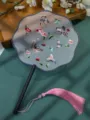 Chinese style embroidered round fan with butterfly pattern and elegant pink tassel. - Double-Sided Embroidered 8-Petal Fan - Singing Warblers & Dancing Butterflies (Beechwood Handle)