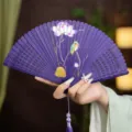 Purple Chinese style folding fan, hollow carved bamboo ribs with lotus bird painting. - Purple Kingfisher and Lotus