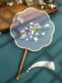 Chinese embroidered round fan with wooden handle and white tassel, blue floral variant. - Double-Sided Embroidered 8-Petal Fan - Flower Fairy (Beechwood Handle)