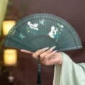 Traditional Chinese bamboo folding fan carved hollow hand fan with floral pattern and tassel - Green Fluttering Butterfly