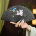 Black wooden folding fan hollow carved vintage Chinese style hand fan with bird lotus print - Black Lotus Fragrance
